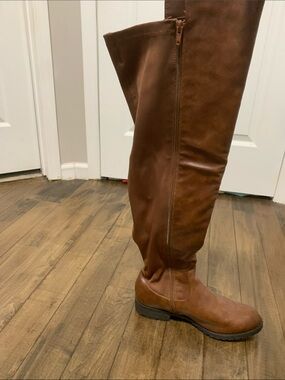 Women’s knee high pair of brown boots